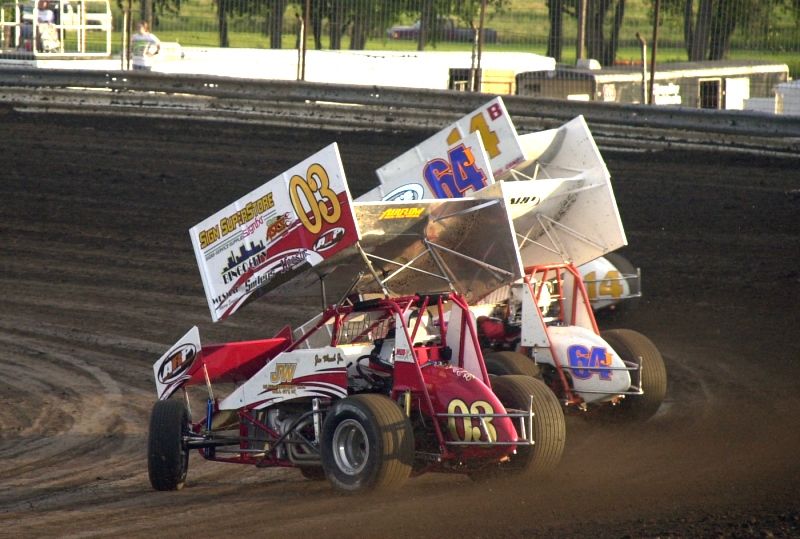 Joe Wood, Jr. (03), Johnny Miller (64J) and Robert Byrom (14b) charge through turns three and four in Friday's ASCS Sooner Region action at Boyd (TX) Raceway.