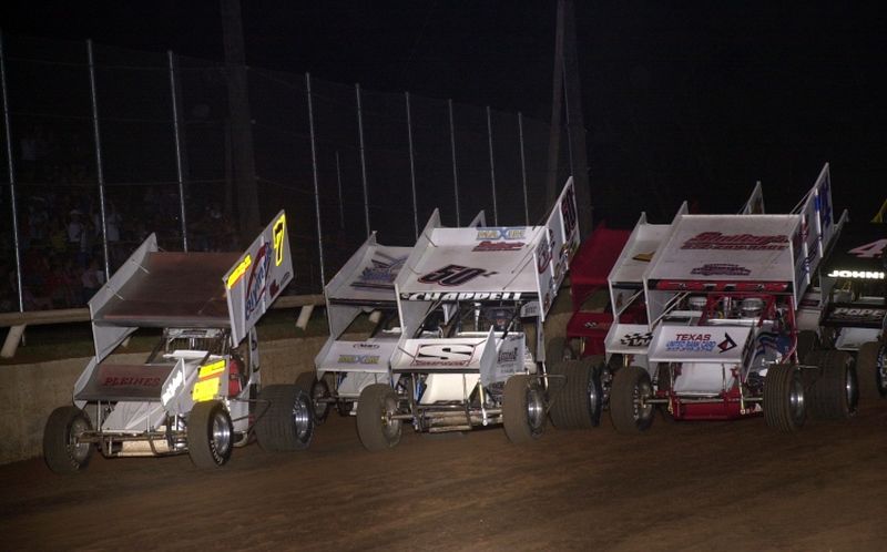 Claud Estes (74), Zach Chappell (50z) and J.J. Hickle (7) lead the three-wide salute prior to Saturday night's 16th Annual Toyota Tundra ASCS Sizzlin' Summer Speedweek main event featuring the O'Reilly American Sprint Cars on Tour at Little Rock's I-