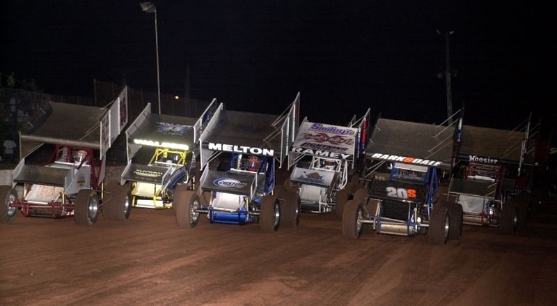 Sheldon Barksdale (20s), Justin Melton (11) and Robert Sellers (25) lead the three-wide salute prior to Saturday night's 25-lap American Bank of Oklahoma ASCS Sooner Region feature event at Lawton Speedway.