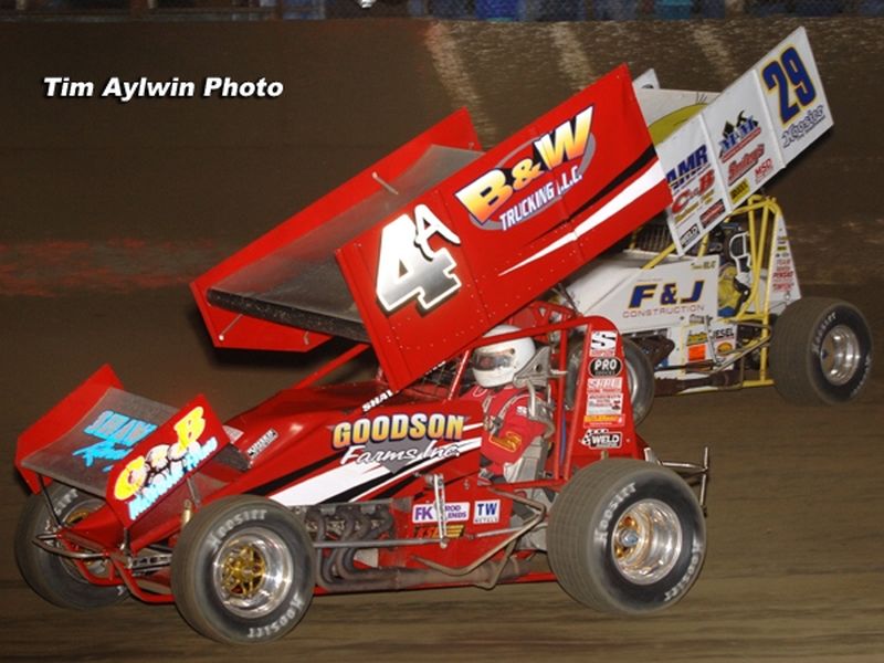 Florida's Kenny Adams (4a) and Texas shoe Travis Rilat (29) battled for position among the top five throughout Saturday night's 40-lap O'Reilly American Sprint Cars on Tour feature at East Bay Raceway Park's 32nd Annual Winter Nationals in Tampa, FL.