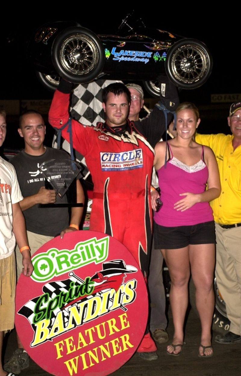 Robert Ballou shows off the coveted Pedal Car trophy after winning the final leg