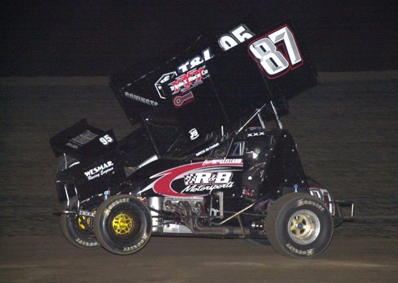 Brian McClelland (87) battles past Matt Covington (95) en route to winning Friday night's 25-lap American Bank of Oklahoma ASCS Sooner Region feature at Boyd (TX) Raceway.