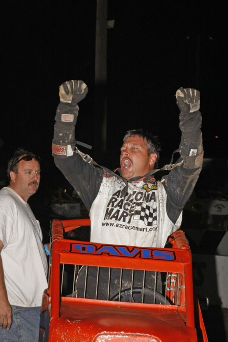 Charles Davis, Jr., celebrates his victory in Saturday night's 30-lap Discount Tire Co. ASCS Canyon Region feature atop Manzanita Speedway's 1/3-mile clay oval.