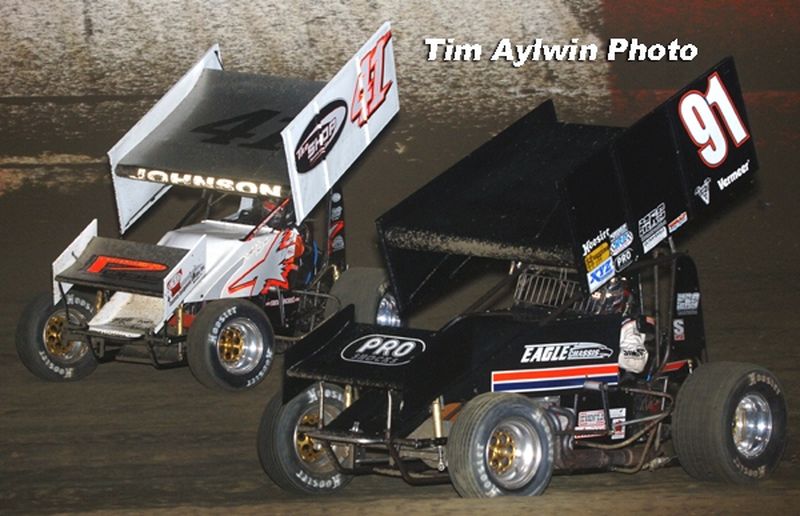 Eventual second-place finisher Jason Johnson (41) battles for position with Don Droud, Jr. (91) in Friday night's 25-lap O'Reilly American Sprint Cars on Tour National feature at East Bay Raceway Park's 32nd Annual Winter Nationals in Tampa, FL.