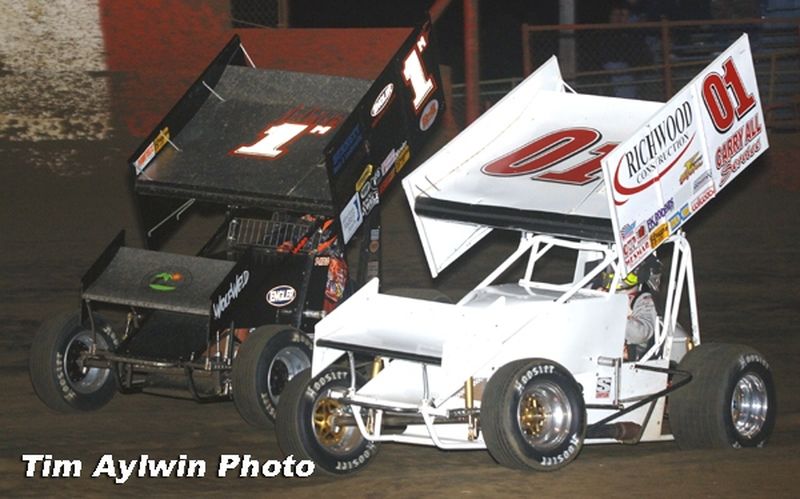 Terry McCarl (1m) battles past Gary Wright (01) en route to winning Friday night's 25-lap O'Reilly American Sprint Cars on Tour National feature at East Bay Raceway Park's 32nd Annual Winter Nationals in Tampa, FL.