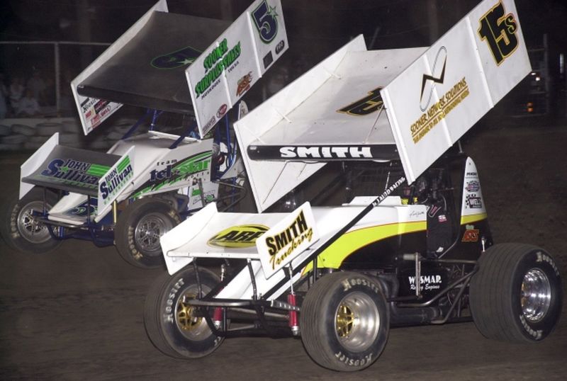 Nick Smith (15s) and Gary Taylor (5*) battled in side-by-side fashion for the lead over the opening 15 laps of Saturday night's American Bank of Oklahoma ASCS Sooner Region feature at Creek County Speedway in Sapulpa, OK.
