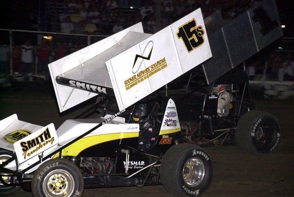 Sean McClelland (1) puts the pressure on Nick Smith (15s) in the final stages of Saturday night's 25-lap American Bank of Oklahoma ASCS Sooner Region feature at Creek County Speedway in Sapulpa, OK.