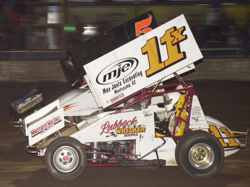 Garry Lee Maier (11x) and Danny Lasoski battle for the lead in the final stages of Friday night's 25-lap O'Reilly American Sprint Cars on Tour feature at Oklahoma City's State Fair Speedway.