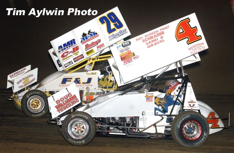 Travis Rilat (29) and Danny Smith (4) battle for position among the top-five in the latter stages of Thursday night's season-opening 25-lap feature event for the O'Reilly American Sprint Cars on Tour National series at East Bay Raceway Park's 32nd Ann