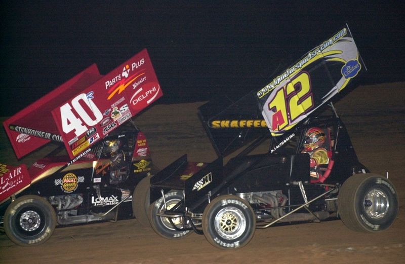 Eventual race winner Tim Shaffer (a12) battles with Ricky Stenhouse, Jr. (40r)