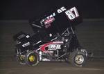 Brian McClelland (87) battles past Matt Covington (95) en route to winning Friday night's 25-lap American Bank of Oklahoma ASCS Sooner Region feature at Boyd (TX) Raceway.