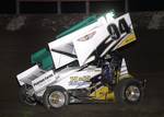 Wayne Johnson (94) races to the inside of Natalie Sather (94s) to take the lead on the opening round of Friday night's 25-lap O'Reilly American Sprint Cars on Tour National series feature at Lakeside Speedway in Kansas City, KS.