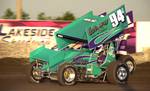 Fargo's Natalie Sather (94s) fends off Brian Brown for an O'Reilly ASCoT heat race win at Lakeside Speedway in Kansas City, KS, on Friday night.