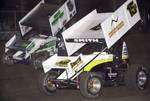 Nick Smith (15s) and Gary Taylor (5*) battled in side-by-side fashion for the lead over the opening 15 laps of Saturday night's American Bank of Oklahoma ASCS Sooner Region feature at Creek County Speedway in Sapulpa, OK.