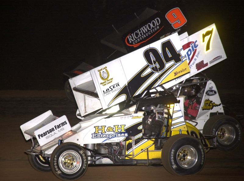 Wayne Johnson (94), J.J. Hickle (7) and Gary Wright (9) battle for position in Saturday night's 16th Annual Toyota Tundra ASCS Sizzlin' Summer Speedweek feature event at Little Rock's I-30 Speedway.