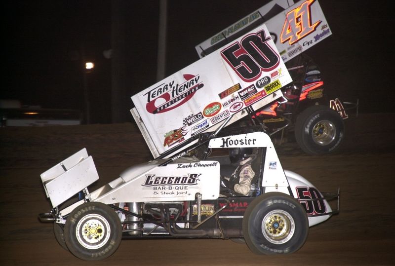 Zach Chappell (50z) and Jason Johnson (41) dice for runner-up honors in Saturday night's 16th Annual Toyota Tundra ASCS Sizzlin' Summer Speedweek main event at Little Rock's I-30 Speedway.
