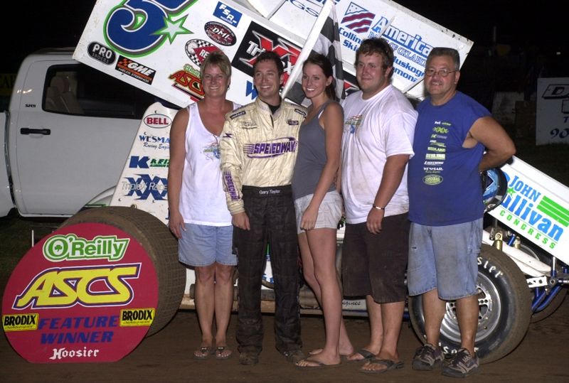 Gary Taylor and the Tel-Star Communications crew in O'Reilly ASCoT victory lane after topping the opening night of the 16th Annual Toyota Tundra ASCS Speedweek at Sixty-Seven Texarkana Speedway.