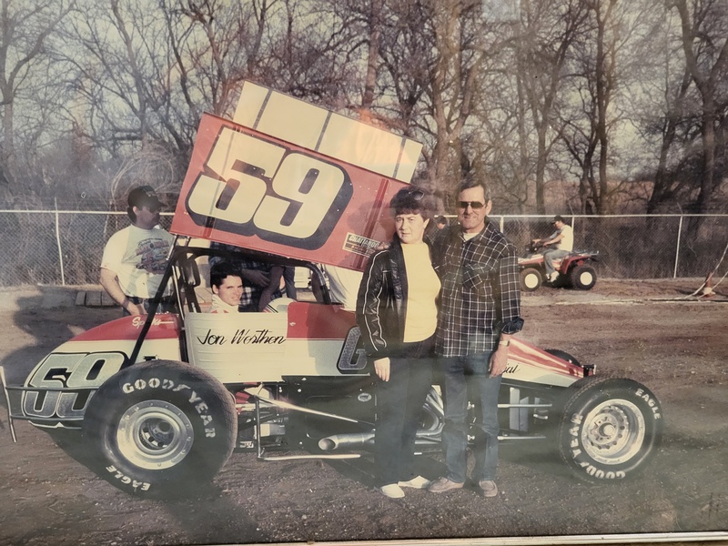 Gene and Wilma McDaniel in front of 1987 Champ car. Jon Werthen in the driver seat and Rick H. hiding behind the wing
