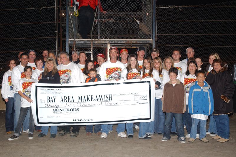 Dave Pusateri and the Trophy Cup Crew present a check for$35,000 for Make A Wish